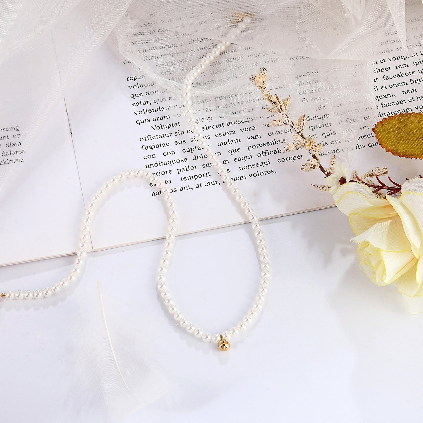 Pearl Necklace With a Small Golden Ball